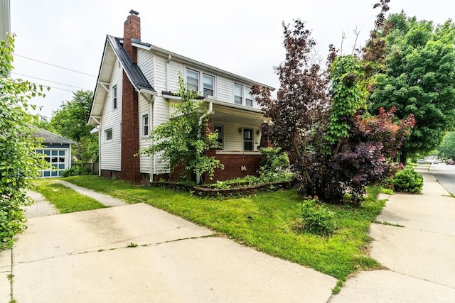 2130 N Wells St, Fort Wayne, IN 46808 - view of front of house with a chimney and a front lawn