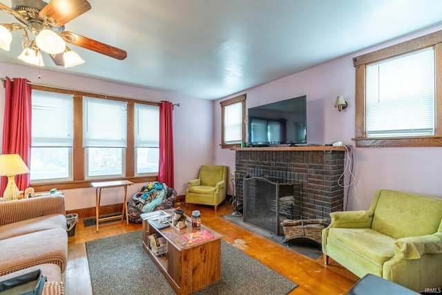 2130 N Wells St, Fort Wayne, IN 46808 - living area with a fireplace, wood finished floors, and a ceiling fan