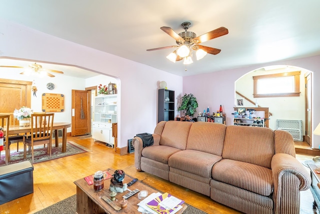 2130 N Wells St, Fort Wayne, IN 46808 - living room with ceiling fan, arched walkways, and light wood-style flooring