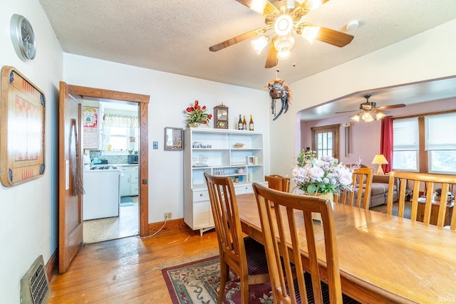 2130 N Wells St, Fort Wayne, IN 46808 - dining room featuring a ceiling fan, light wood-style flooring, and a textured ceiling