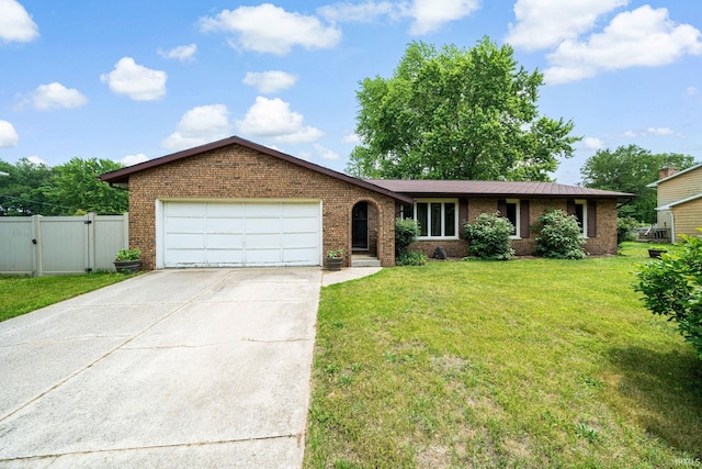 55698 Willowbend Blvd, Bristol, IN 46507 - ranch-style home with brick siding, an attached garage, concrete driveway, and a gate