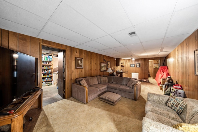 55698 Willowbend Blvd, Bristol, IN 46507 - carpeted living room featuring wooden walls and a paneled ceiling