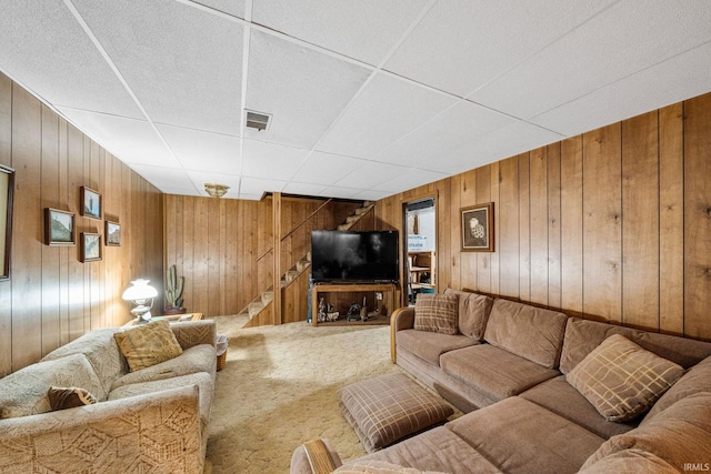 55698 Willowbend Blvd, Bristol, IN 46507 - living area featuring stairs, carpet, and wooden walls