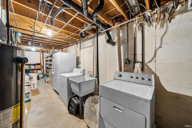55698 Willowbend Blvd, Bristol, IN 46507 - unfinished basement featuring gas water heater, washer and dryer, and freestanding refrigerator