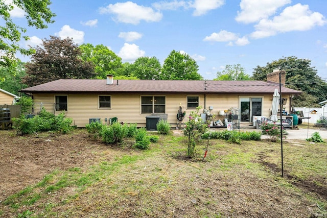 55698 Willowbend Blvd, Bristol, IN 46507 - rear view of property featuring a patio area and a chimney