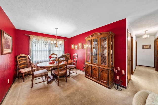 55698 Willowbend Blvd, Bristol, IN 46507 - carpeted dining room featuring a textured ceiling and a chandelier
