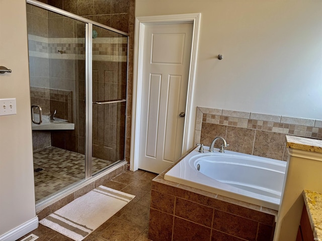 3638 Swansea Dr, West Lafayette, IN 47906 - bathroom with a bath, a shower stall, vanity, and tile patterned floors