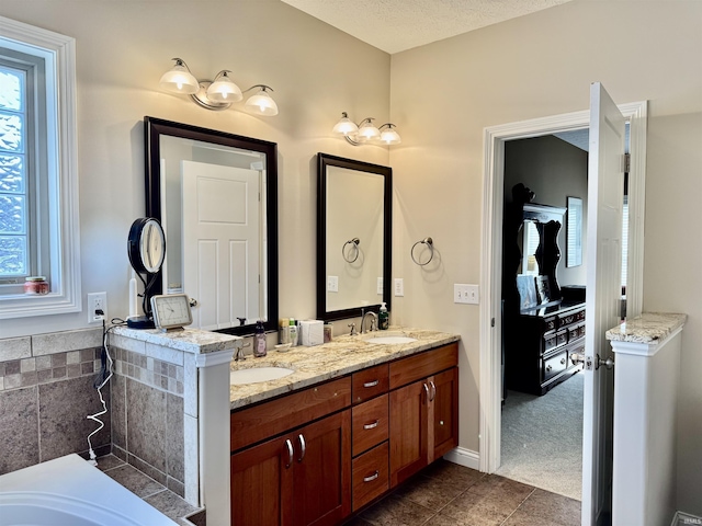 3638 Swansea Dr, West Lafayette, IN 47906 - bathroom with double vanity, a bathtub, and tile patterned floors