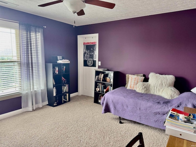 3638 Swansea Dr, West Lafayette, IN 47906 - bedroom featuring multiple windows, a textured ceiling, carpet flooring, and a ceiling fan