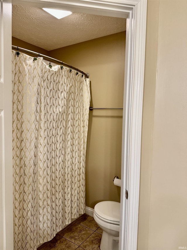 3638 Swansea Dr, West Lafayette, IN 47906 - full bath with tile patterned floors, a textured ceiling, and a shower with shower curtain