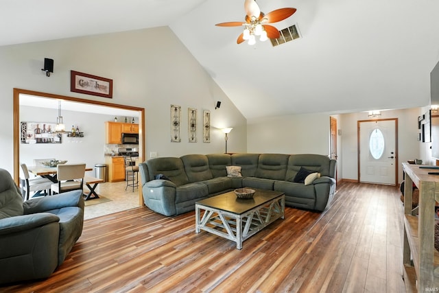 5432 Argiano Xing, Fort Wayne, IN 46845 - living room with a ceiling fan, light wood finished floors, and high vaulted ceiling