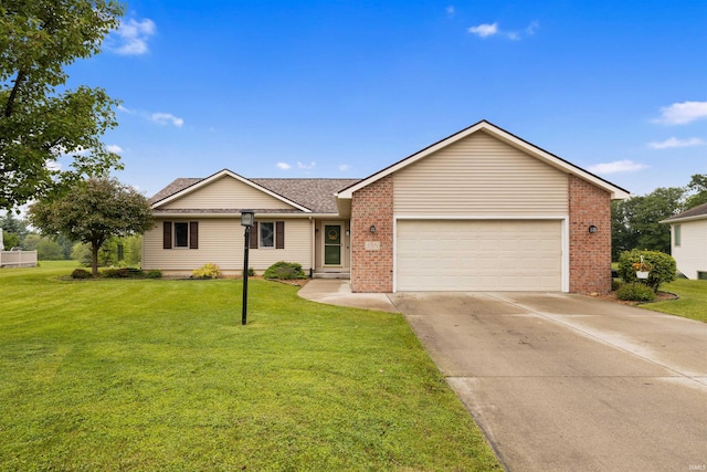 5371 Bear Creek Pass, Auburn, IN 46706 - ranch-style home featuring an attached garage, driveway, brick siding, a front lawn, and roof with shingles
