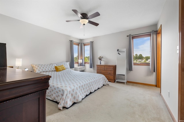 5371 Bear Creek Pass, Auburn, IN 46706 - bedroom featuring light carpet, multiple windows, and ceiling fan