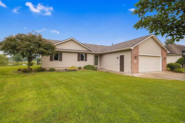 5371 Bear Creek Pass, Auburn, IN 46706 - ranch-style house with an attached garage, a front lawn, driveway, a shingled roof, and brick siding