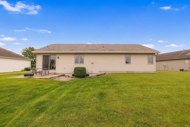 5371 Bear Creek Pass, Auburn, IN 46706 - rear view of house with a patio and a yard