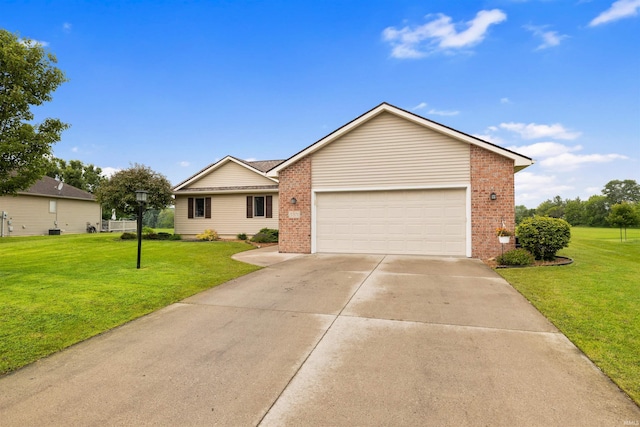 5371 Bear Creek Pass, Auburn, IN 46706 - ranch-style home with brick siding, a front lawn, driveway, and an attached garage