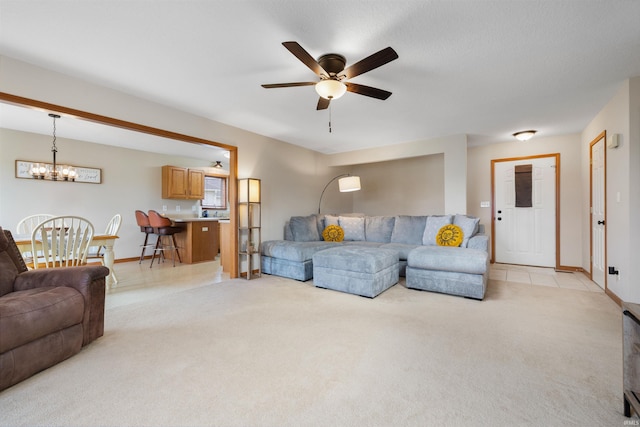 5371 Bear Creek Pass, Auburn, IN 46706 - living area with light carpet, ceiling fan, and a chandelier