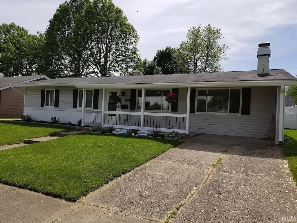 1101 N Berkley St, Kokomo, IN 46901 - single story home with a chimney and a front yard