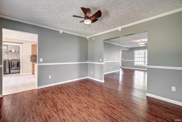 4539 N Shadow Wood Dr, Bloomington, IN 47404 - empty room with ceiling fan, separate washer and dryer, a textured ceiling, crown molding, and wood finished floors
