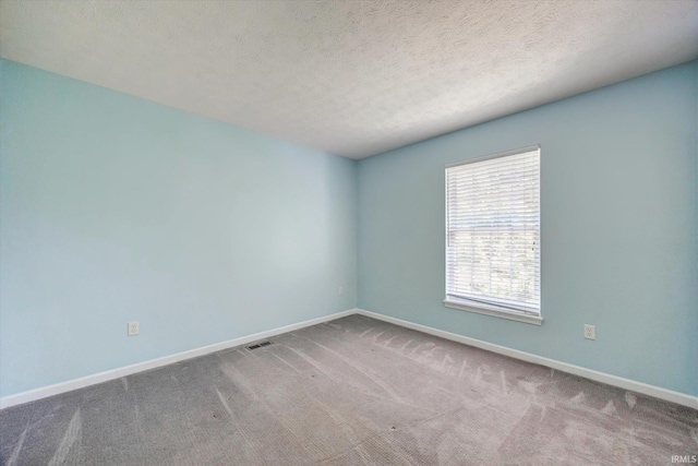 4539 N Shadow Wood Dr, Bloomington, IN 47404 - carpeted empty room featuring baseboards and a textured ceiling