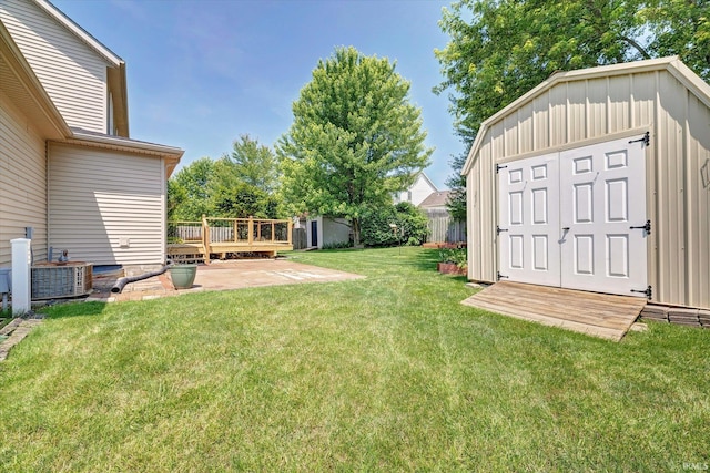 4539 N Shadow Wood Dr, Bloomington, IN 47404 - fenced yard featuring a wooden deck, a storage unit, and a patio area