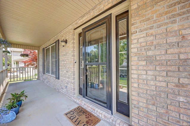 4539 N Shadow Wood Dr, Bloomington, IN 47404 - property entrance featuring a porch and brick siding