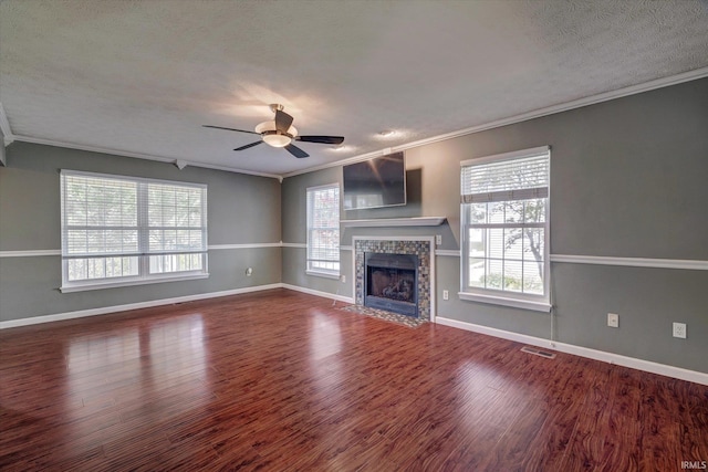 4539 N Shadow Wood Dr, Bloomington, IN 47404 - unfurnished living room with ornamental molding, a ceiling fan, wood finished floors, a fireplace, and a textured ceiling