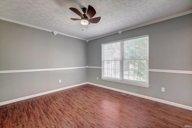 4539 N Shadow Wood Dr, Bloomington, IN 47404 - spare room featuring ceiling fan, a textured ceiling, crown molding, and wood finished floors