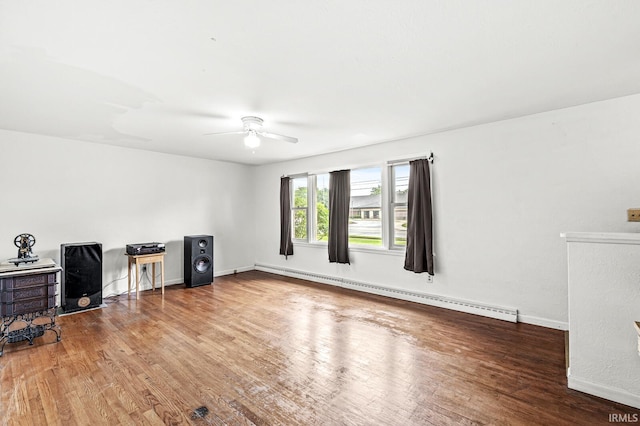 2514 Wood St, Elkhart, IN 46514 - living room featuring a baseboard radiator, wood finished floors, and ceiling fan