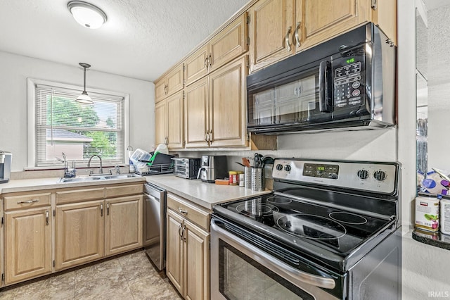 2514 Wood St, Elkhart, IN 46514 - kitchen featuring appliances with stainless steel finishes, light countertops, a textured ceiling, hanging light fixtures, and light brown cabinets