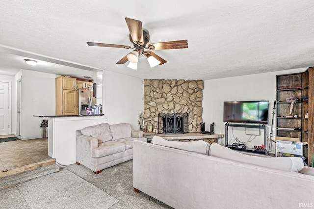 2514 Wood St, Elkhart, IN 46514 - living room with a textured ceiling, ceiling fan, and a fireplace