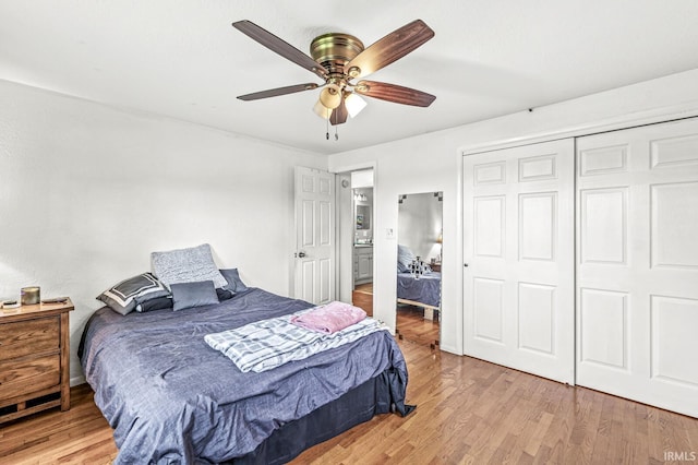 2514 Wood St, Elkhart, IN 46514 - bedroom with light wood-type flooring, a closet, and a ceiling fan