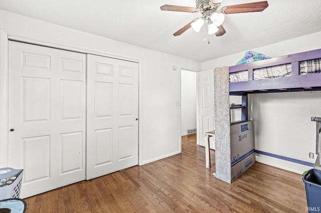 2514 Wood St, Elkhart, IN 46514 - bedroom with wood finished floors, a closet, and ceiling fan