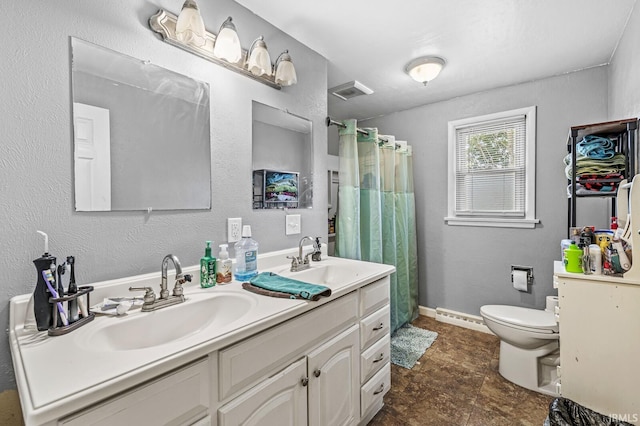 2514 Wood St, Elkhart, IN 46514 - bathroom with double vanity, a shower with curtain, and a baseboard heating unit