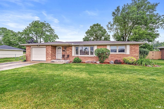 2514 Wood St, Elkhart, IN 46514 - ranch-style house featuring brick siding, driveway, and a garage