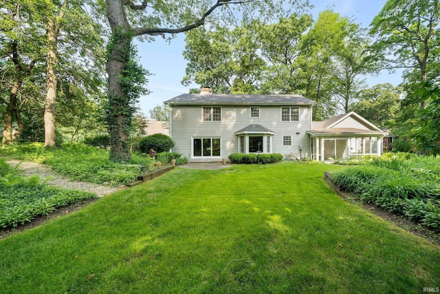17112 Ridgefield Ct, Granger, IN 46530 - back of house featuring a chimney and a yard