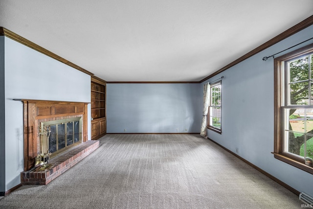 17112 Ridgefield Ct, Granger, IN 46530 - unfurnished living room featuring crown molding, carpet, a fireplace, and built in shelves
