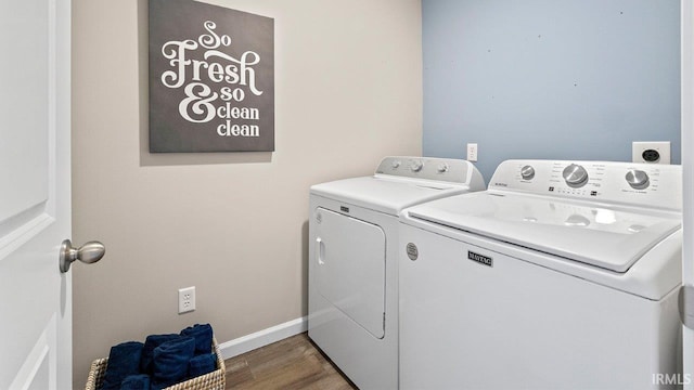 12967 Solo Ln, Fort Wayne, IN 46818 - laundry room with washer and dryer and wood finished floors