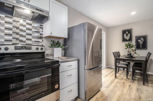 60220 Ruby St, South Bend, IN 46614 - kitchen featuring stainless steel appliances, ventilation hood, white cabinetry, light wood-style flooring, and recessed lighting