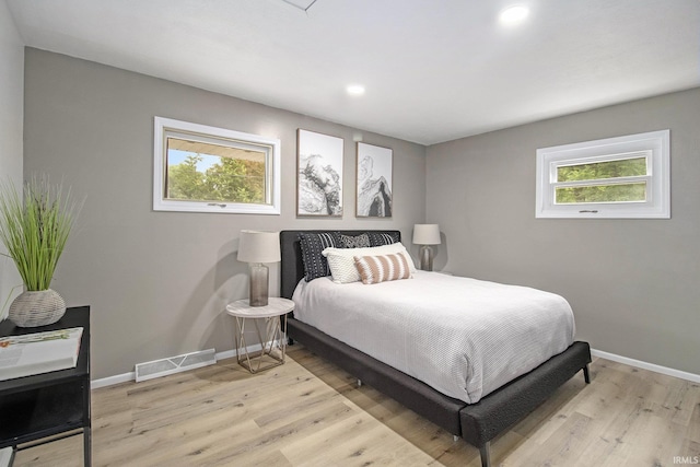 60220 Ruby St, South Bend, IN 46614 - bedroom with light wood-style floors and recessed lighting