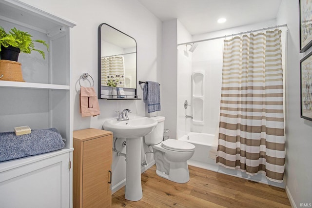 60220 Ruby St, South Bend, IN 46614 - full bath featuring wood finished floors, shower / bath combination with curtain, and recessed lighting