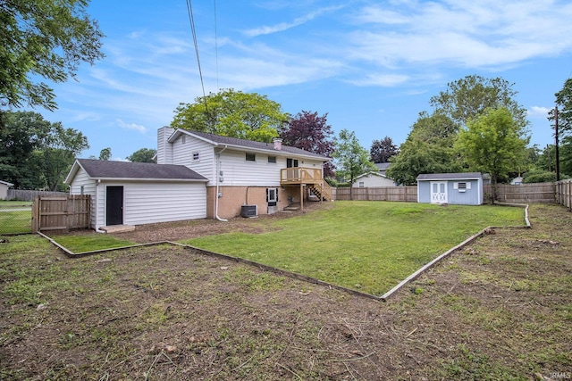 60220 Ruby St, South Bend, IN 46614 - fenced backyard with stairway, a shed, and a deck