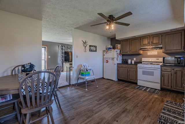 272 Sherman St, Wabash, IN 46992 - kitchen featuring white appliances, under cabinet range hood, dark countertops, a textured ceiling, and a ceiling fan