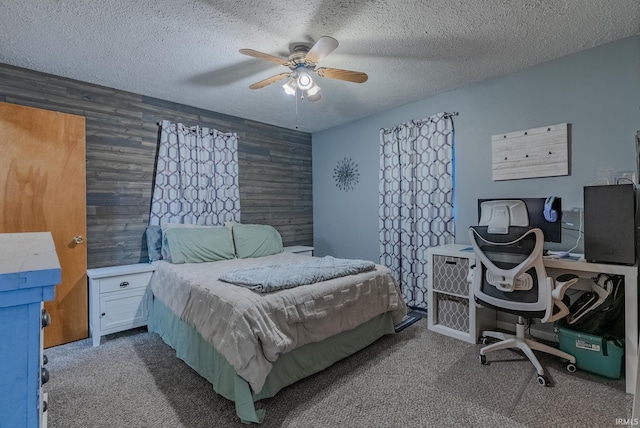 272 Sherman St, Wabash, IN 46992 - carpeted bedroom with a textured ceiling, wooden walls, ceiling fan, and an office area