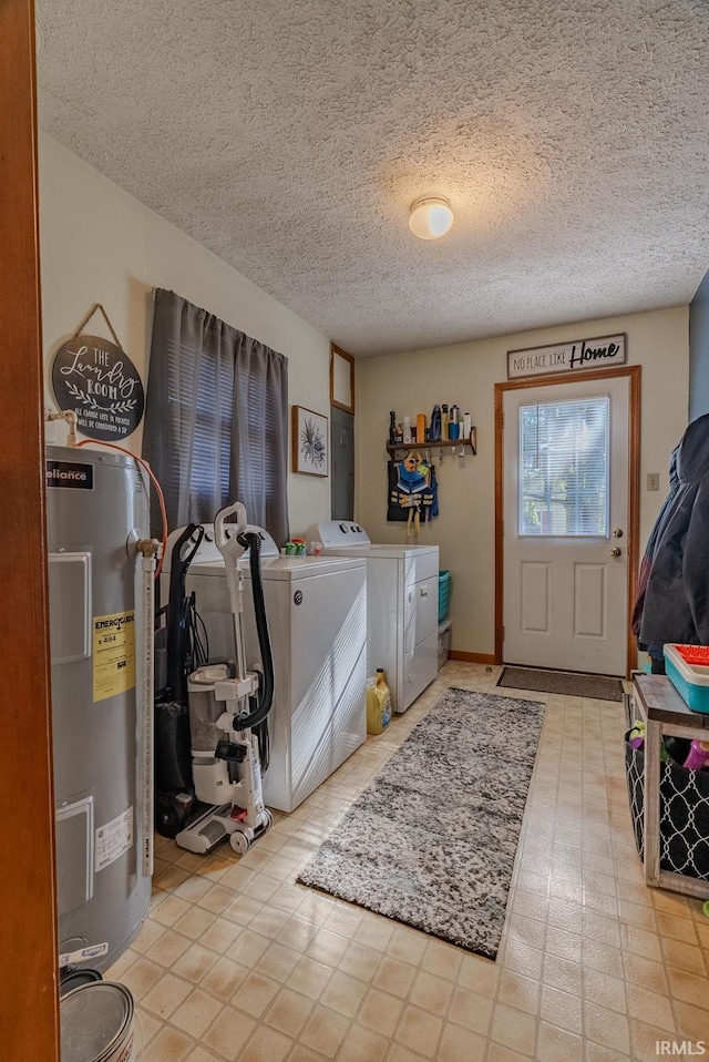 272 Sherman St, Wabash, IN 46992 - washroom with washer and dryer, water heater, and a textured ceiling
