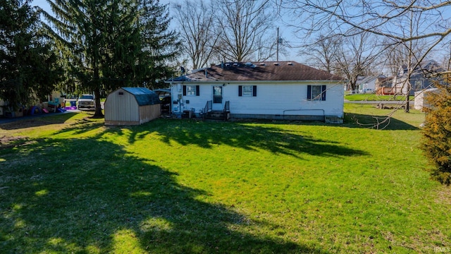 272 Sherman St, Wabash, IN 46992 - rear view of property with a storage shed and a lawn