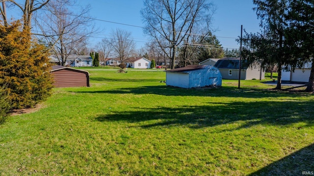 272 Sherman St, Wabash, IN 46992 - view of green lawn featuring a storage unit