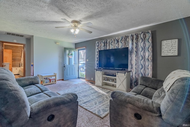 272 Sherman St, Wabash, IN 46992 - carpeted living room featuring a ceiling fan and a textured ceiling