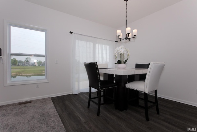 13710 Copper Strike Pass, Fort Wayne, IN 46845 - dining area with dark wood-style floors, a chandelier, and healthy amount of natural light