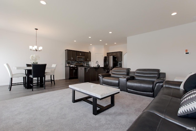 13710 Copper Strike Pass, Fort Wayne, IN 46845 - living room with a chandelier, recessed lighting, and light wood-style floors